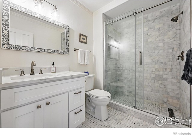 290 Skyhill Dr, Evergreen, CO 80439 - bathroom featuring crown molding, vanity, toilet, and a stall shower