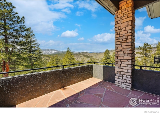 290 Skyhill Dr, Evergreen, CO 80439 - view of patio featuring a balcony and a mountain view