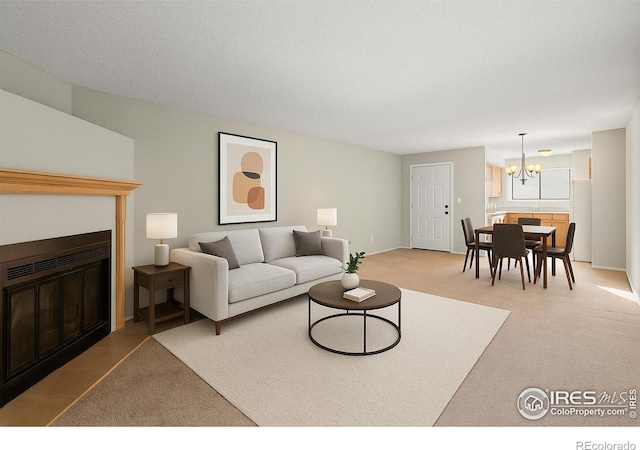 316 Wright St Unit 203, Lakewood, CO 80228 - carpeted living area featuring a chandelier and a fireplace with flush hearth