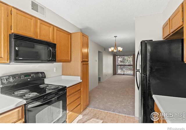 316 Wright St Unit 203, Lakewood, CO 80228 - kitchen featuring black appliances, a chandelier, light countertops, light carpet, and hanging light fixtures