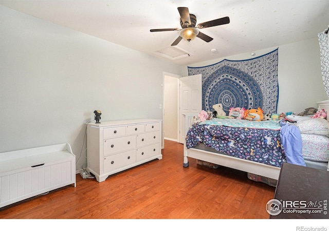 2502 Ballard Ln, Fort Collins, CO 80524 - bedroom with radiator, light wood-style flooring, and ceiling fan