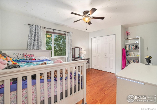 2502 Ballard Ln, Fort Collins, CO 80524 - bedroom with wood finished floors, a closet, and ceiling fan