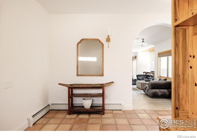 320 Elk Ln, Grand Lake, CO 80447 - hallway with arched walkways, a baseboard radiator, and baseboards