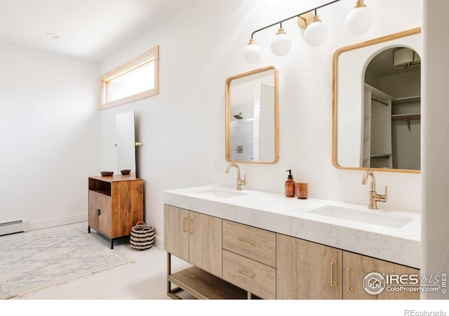 320 Elk Ln, Grand Lake, CO 80447 - bathroom featuring double vanity and a baseboard radiator