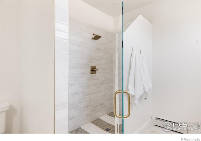 320 Elk Ln, Grand Lake, CO 80447 - full bath featuring a stall shower, toilet, a baseboard heating unit, and baseboards