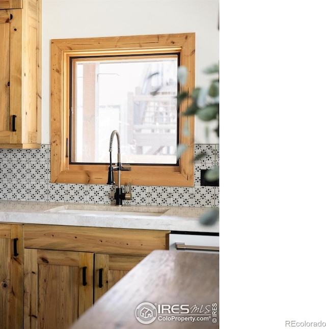 320 Elk Ln, Grand Lake, CO 80447 - kitchen with a sink, backsplash, and light countertops