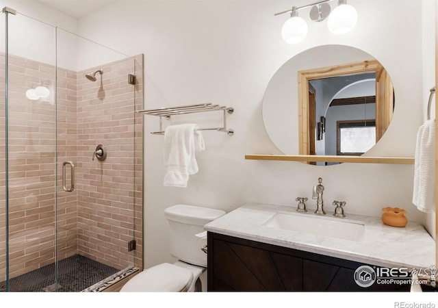 320 Elk Ln, Grand Lake, CO 80447 - full bathroom featuring toilet, vanity, and a stall shower