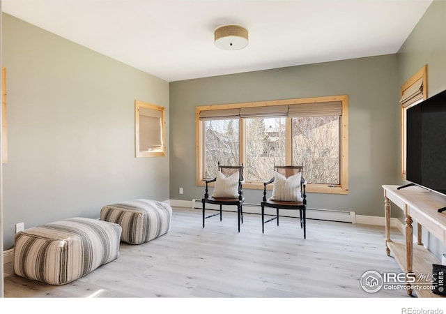 320 Elk Ln, Grand Lake, CO 80447 - sitting room featuring light wood-style floors, a baseboard heating unit, and baseboards