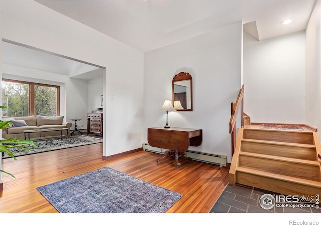 4157 19th St, Boulder, CO 80304 - entrance foyer featuring a baseboard radiator, wood finished floors, and stairway