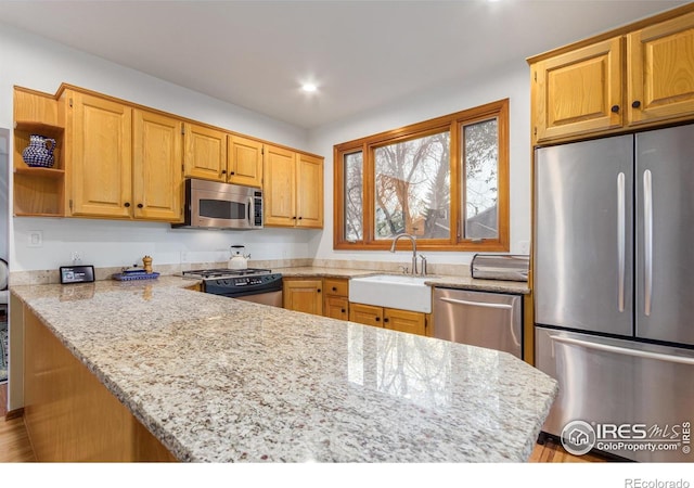 4157 19th St, Boulder, CO 80304 - kitchen with appliances with stainless steel finishes, a sink, light stone countertops, open shelves, and recessed lighting
