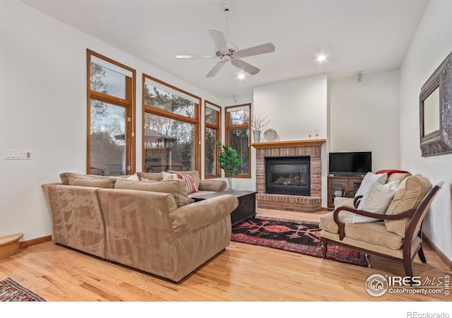 4157 19th St, Boulder, CO 80304 - living room featuring wood finished floors, a fireplace, a ceiling fan, baseboards, and recessed lighting