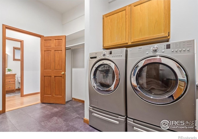 4157 19th St, Boulder, CO 80304 - laundry room featuring cabinet space, separate washer and dryer, and baseboards
