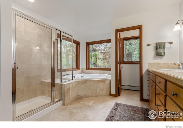 4157 19th St, Boulder, CO 80304 - bathroom with a baseboard heating unit, vanity, a garden tub, a shower stall, and tile patterned flooring