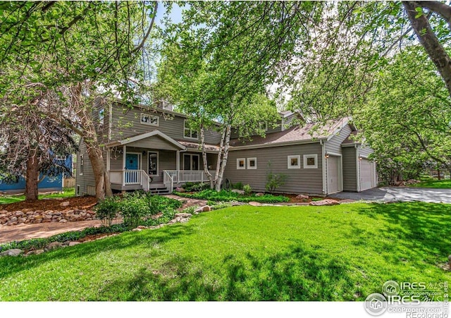 4157 19th St, Boulder, CO 80304 - view of front of house with a porch, a front yard, and asphalt driveway