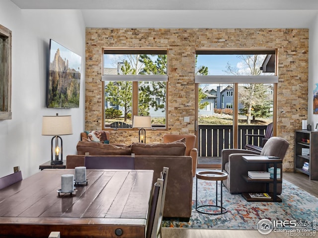 1437 Raven Cir Unit H, Estes Park, CO 80517 - living area featuring wood finished floors and plenty of natural light