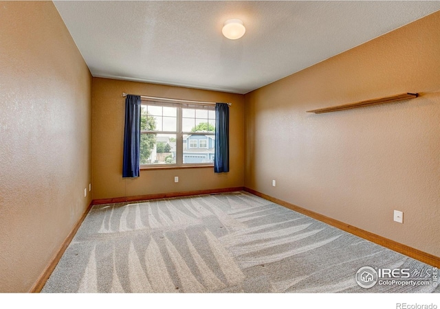 1414 Sheep Creek Ct, Fort Collins, CO 80526 - empty room featuring carpet, a textured wall, and baseboards