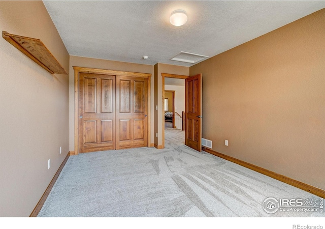 1414 Sheep Creek Ct, Fort Collins, CO 80526 - unfurnished bedroom with attic access, carpet, baseboards, and a textured ceiling