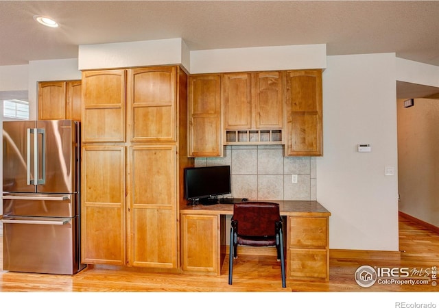 1414 Sheep Creek Ct, Fort Collins, CO 80526 - kitchen with high end fridge, light wood finished floors, decorative backsplash, recessed lighting, and brown cabinets