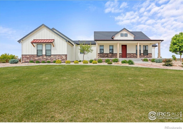 5031 Prairie Lark Ln, Severance, CO 80615 - modern inspired farmhouse with board and batten siding, stone siding, a porch, and a front yard