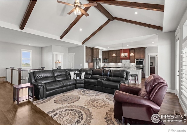 5031 Prairie Lark Ln, Severance, CO 80615 - living room with a ceiling fan, dark wood finished floors, beam ceiling, high vaulted ceiling, and recessed lighting