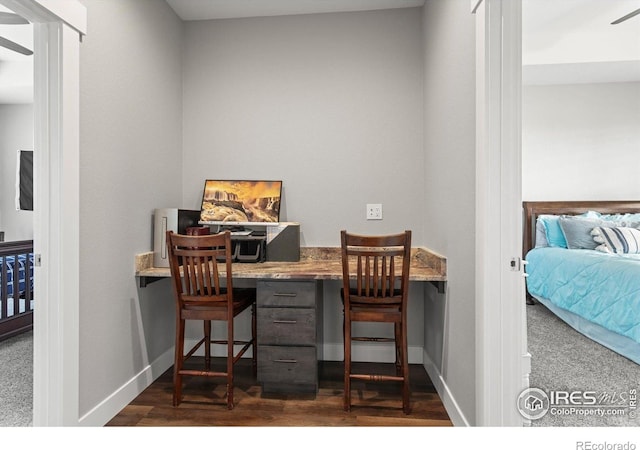 5031 Prairie Lark Ln, Severance, CO 80615 - office area with dark wood finished floors and baseboards
