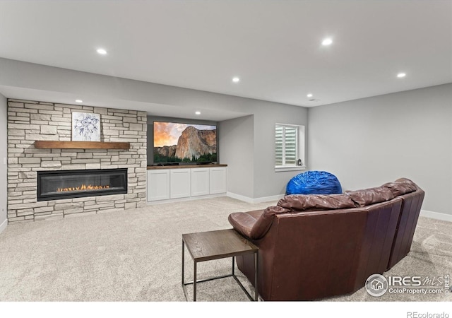 5031 Prairie Lark Ln, Severance, CO 80615 - living area featuring carpet flooring, recessed lighting, baseboards, and a fireplace