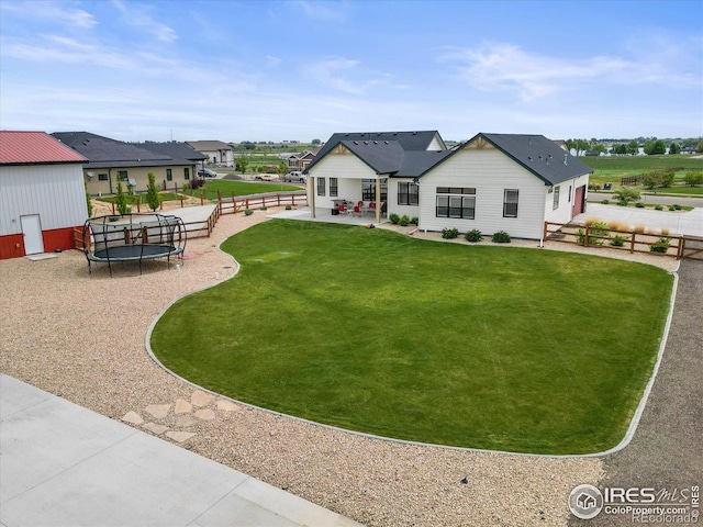 5031 Prairie Lark Ln, Severance, CO 80615 - back of house with a trampoline and a patio