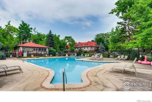 3250 Oneal Cir Unit 14, Boulder, CO 80301 - community pool with a patio area and view of wooded area