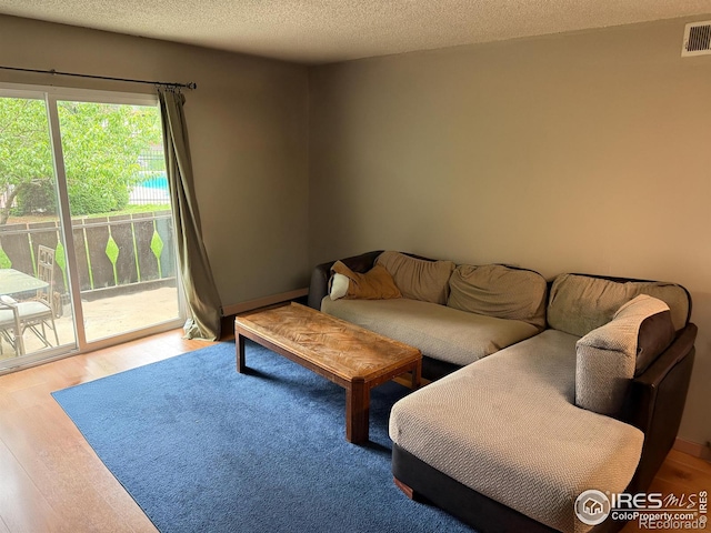 3250 Oneal Cir Unit 14, Boulder, CO 80301 - living room with wood finished floors and a textured ceiling