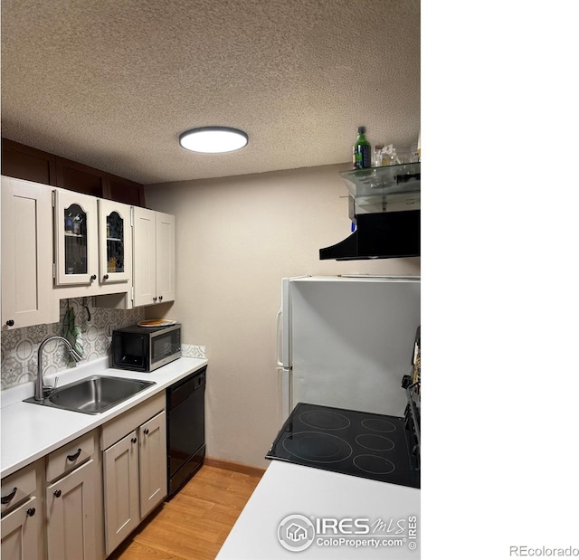 3250 Oneal Cir Unit 14, Boulder, CO 80301 - kitchen with stainless steel microwave, dishwasher, a sink, stove, and light wood-style flooring