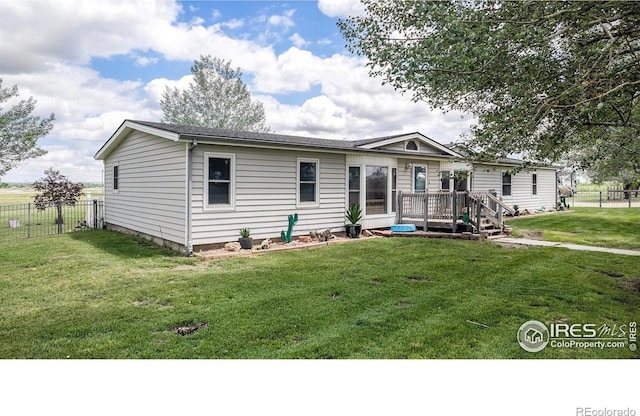 10635 County Road 24, Fort Lupton, CO 80621 - view of front facade featuring a wooden deck