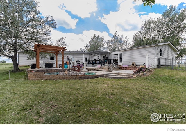 10635 County Road 24, Fort Lupton, CO 80621 - back of property with a pergola, a patio, and a wooden deck