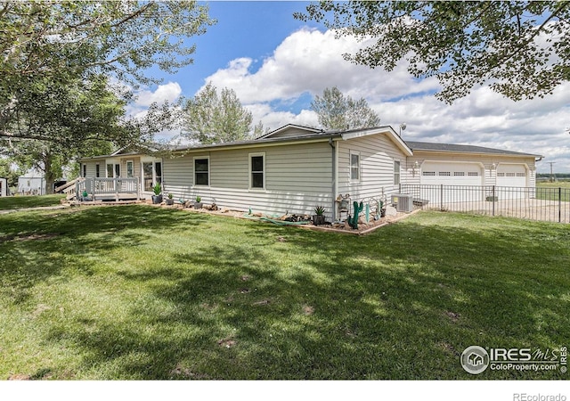 10635 County Road 24, Fort Lupton, CO 80621 - back of house with a wooden deck and driveway
