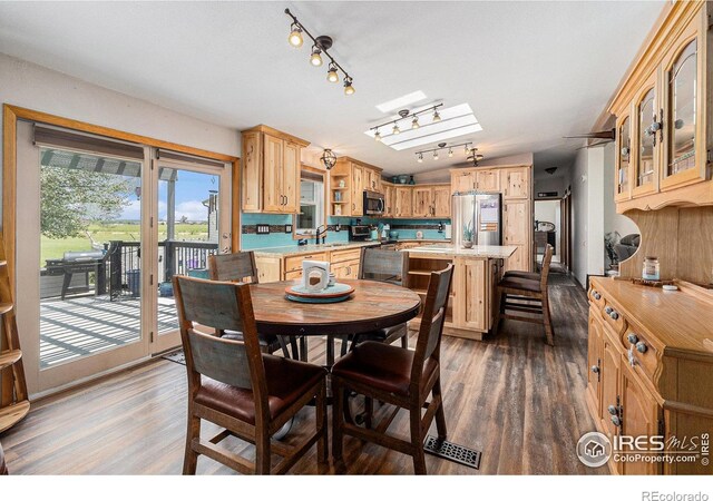 10635 County Road 24, Fort Lupton, CO 80621 - dining space with dark wood-style flooring and rail lighting