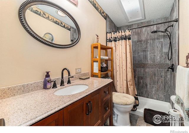 10635 County Road 24, Fort Lupton, CO 80621 - bathroom with vanity, tiled shower, and a textured ceiling