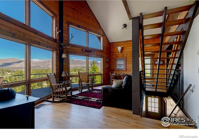 47 County Road 471, Grand Lake, CO 80447 - living area with high vaulted ceiling, wooden walls, wood finished floors, and a mountain view
