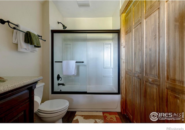 47 County Road 471, Grand Lake, CO 80447 - full bathroom featuring toilet, bath / shower combo with glass door, and vanity