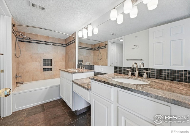 1837 Spaulding Cir, Superior, CO 80027 - bathroom with bathtub / shower combination, vanity, decorative backsplash, and a textured ceiling