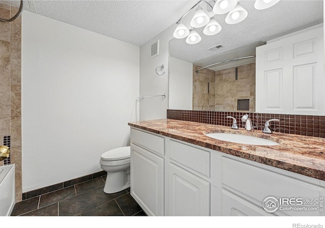 1837 Spaulding Cir, Superior, CO 80027 - full bath featuring toilet, a tile shower, vanity, a textured ceiling, and baseboards