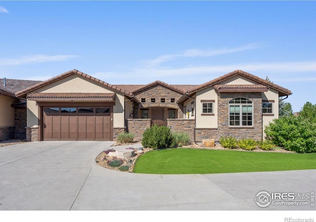 5112 Daylight Ct, Fort Collins, CO 80528 - view of front of home with stone siding, stucco siding, driveway, and a garage