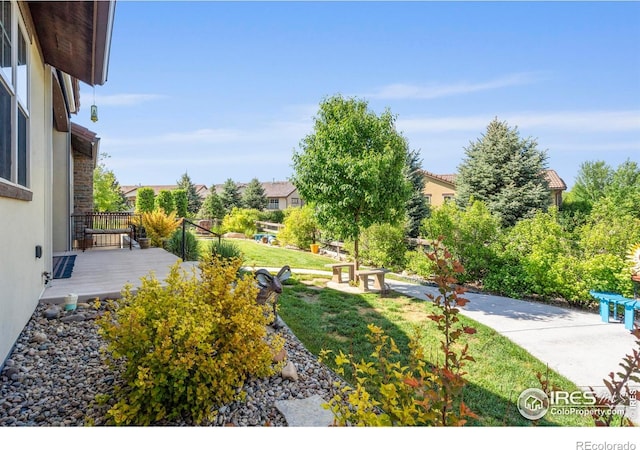 5112 Daylight Ct, Fort Collins, CO 80528 - view of grassy yard with a wooden deck