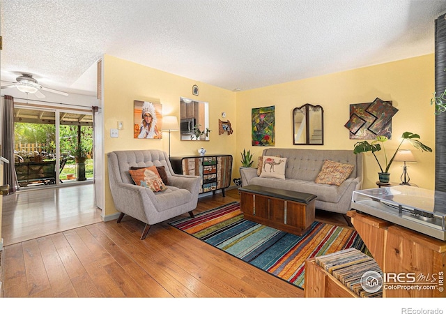 4117 Shannon Dr, Laporte, CO 80535 - living area with a textured ceiling, wood-type flooring, and ceiling fan