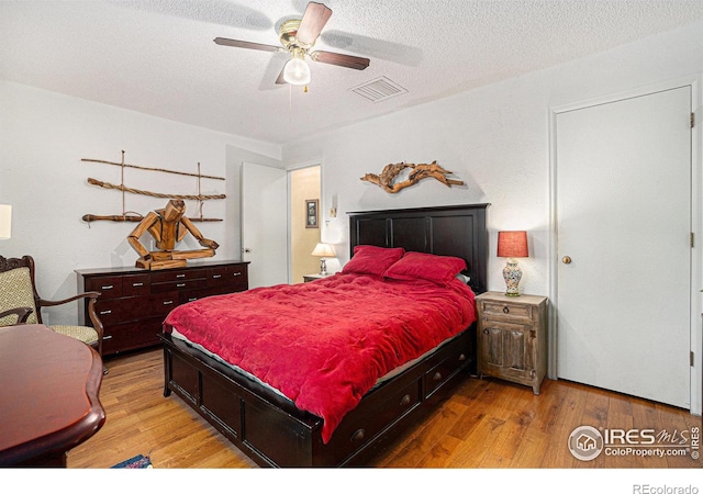 4117 Shannon Dr, Laporte, CO 80535 - bedroom featuring wood finished floors, a textured ceiling, and a ceiling fan