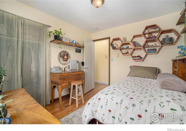 4117 Shannon Dr, Laporte, CO 80535 - bedroom featuring wood finished floors and a textured ceiling