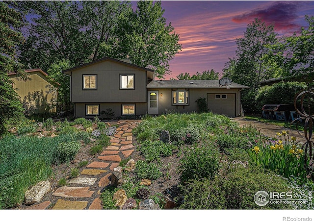 4117 Shannon Dr, Laporte, CO 80535 - tri-level home featuring a garage and dirt driveway
