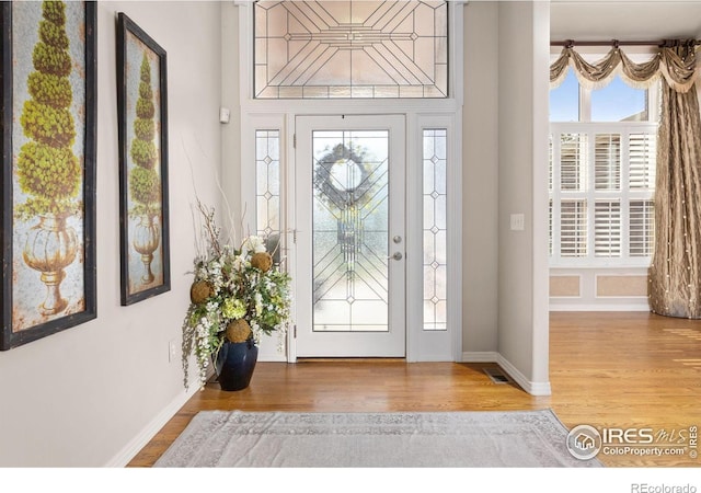 13 Blue Heron Dr, Thornton, CO 80241 - foyer entrance with wood finished floors and baseboards