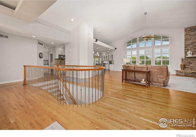 13 Blue Heron Dr, Thornton, CO 80241 - bar featuring wood finished floors, ceiling fan, lofted ceiling, recessed lighting, and baseboards