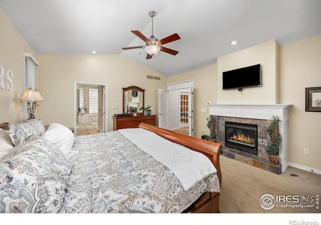13 Blue Heron Dr, Thornton, CO 80241 - carpeted bedroom featuring vaulted ceiling, a tiled fireplace, ceiling fan, and baseboards