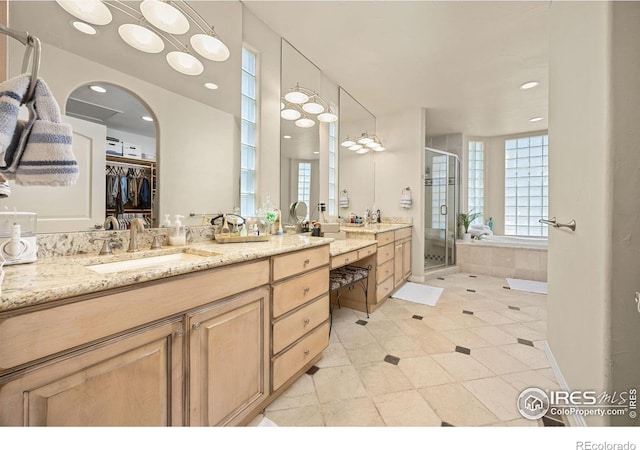 13 Blue Heron Dr, Thornton, CO 80241 - full bathroom featuring vanity, a shower stall, a bath, a spacious closet, and recessed lighting
