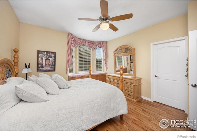 13 Blue Heron Dr, Thornton, CO 80241 - bedroom with wood finished floors, a ceiling fan, and baseboards